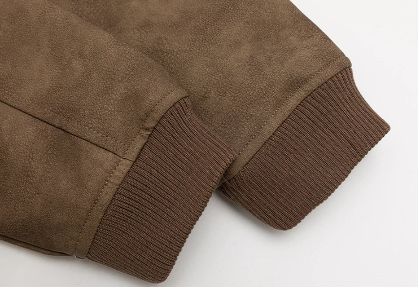 A classic distressed leather jacket in a relaxed, unstructured fit suitable for both men and women
