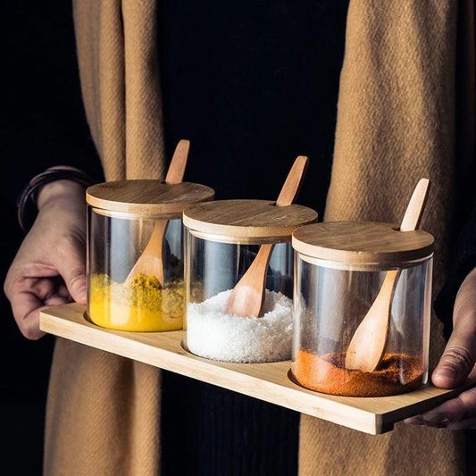 Premium glass and wooden storage jars with serving spoons, featuring a sleek design and airtight seal for fresh and organised kitchen storage