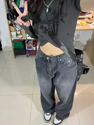 Women's high-waist, wide-leg black denim jeans with multiple pockets and vintage-inspired wash