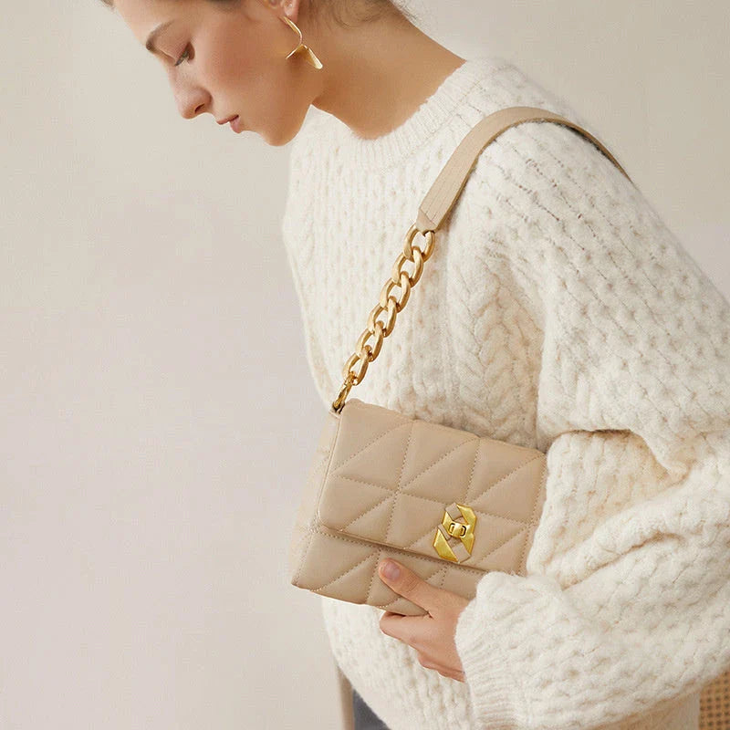 Premium genuine leather crossbody bag in a classic white colour, featuring an adjustable strap and a spacious interior with a zipper pocket.