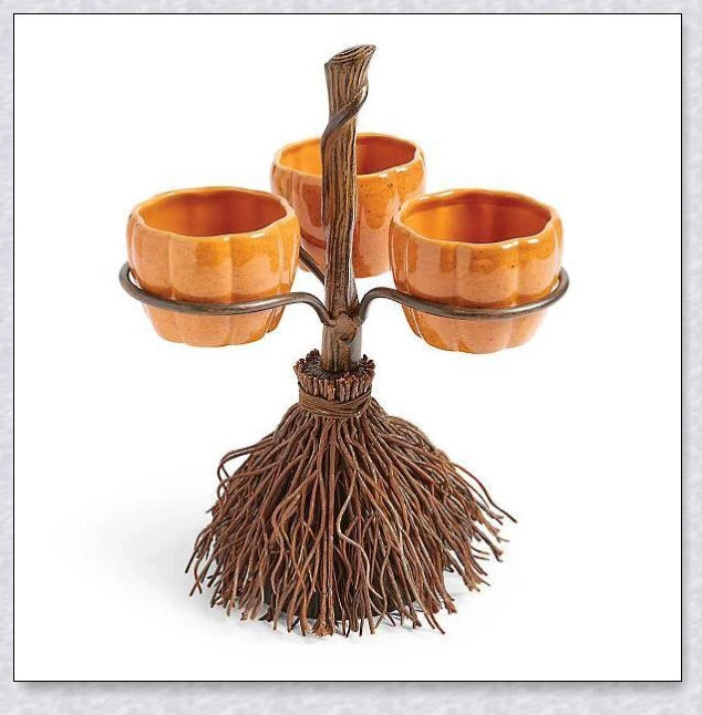 Pumpkin-shaped snack bowls on a broom-inspired stand, perfect for Halloween parties and displays