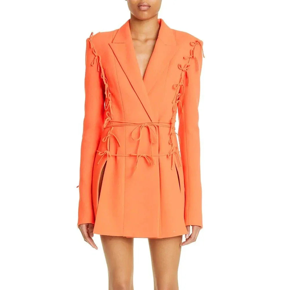 A sophisticated notched collar blazer with an elegant bow detail, perfect for professional and casual wear.
