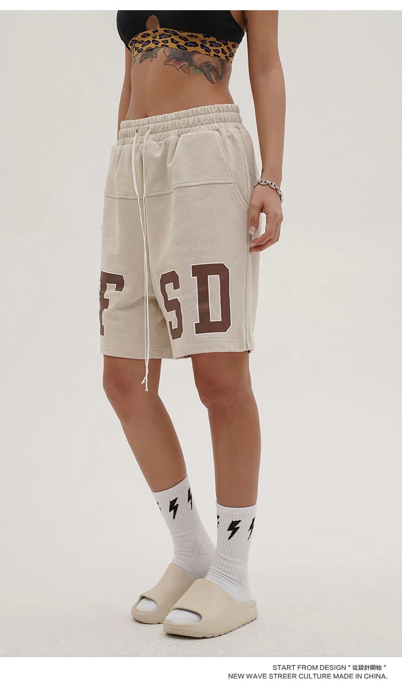 Premium loose-fit sports shorts with eye-catching printed patterns in black, khaki, and dark grey colours