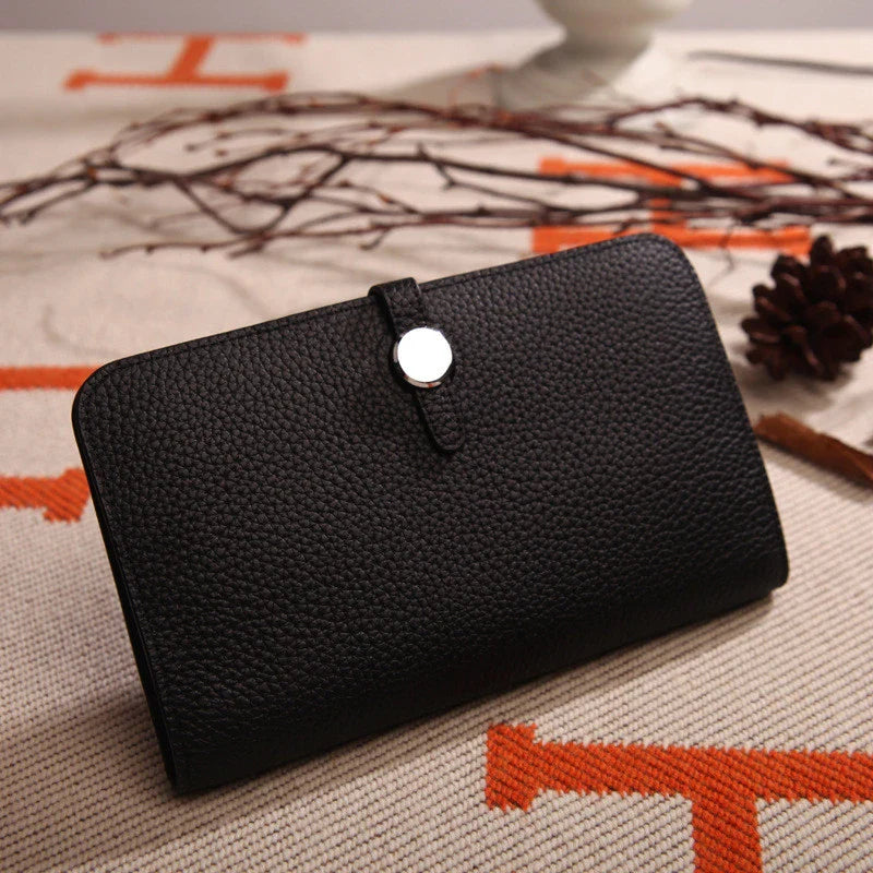Premium cowhide leather wallet with luxurious lychee pattern design, featuring multiple compartments for secure storage and organisation.