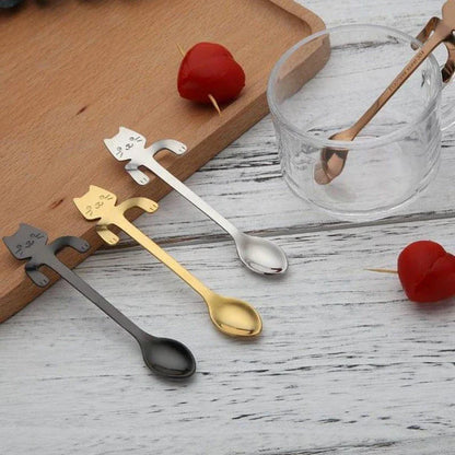 A silver cat-shaped stainless steel coffee spoon with a polished finish