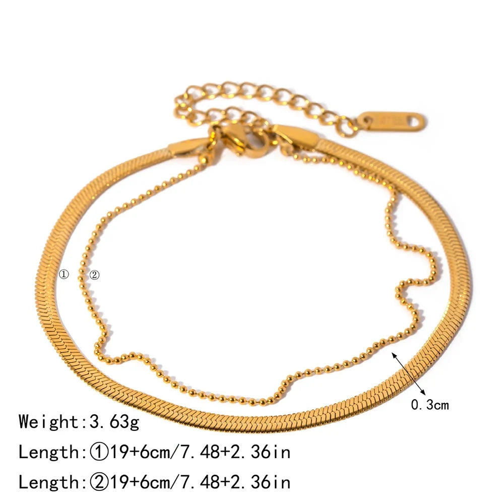 Exquisite 18K gold-plated double layer snake chain anklet with a durable stainless steel base, designed to elevate summer style with timeless elegance.