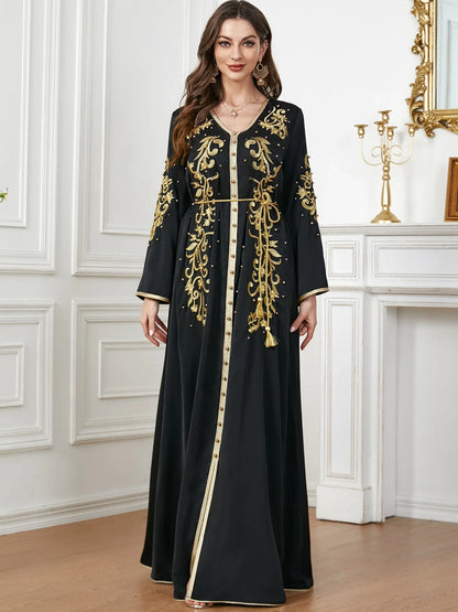 Elegant long-sleeve dress with floral embroidery in a sophisticated sapphire blue colour, suitable for British women