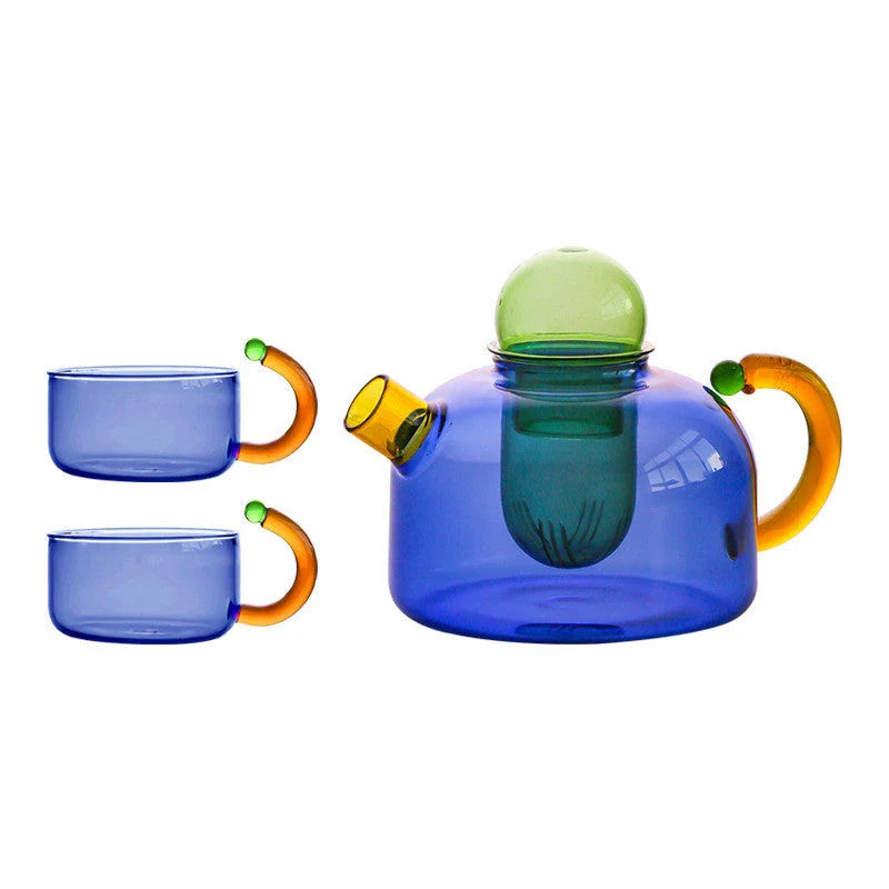 Elegant colourful glass teapot and teacup set with vibrant contrasting colours, perfect for tea and coffee enjoyment
