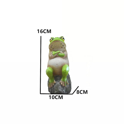 Charming resin frog garden ornaments in various poses and colours, perfect for adding a whimsical touch to outdoor spaces.