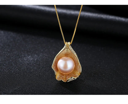 Elegant pearl pendant necklace with sterling silver setting, featuring a modern geometric design