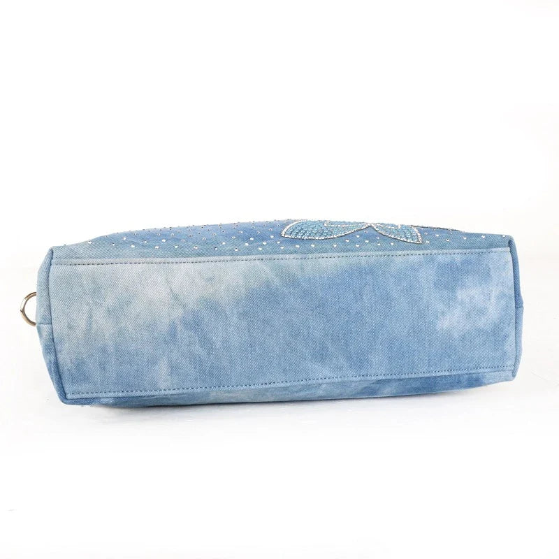 Light blue denim crossbody bag with sparkling diamond-inspired detailing from Trendha