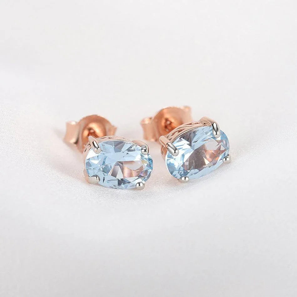 Geometrically simple sterling silver earrings in a rose gold finish, showcasing a minimalist and elegant design