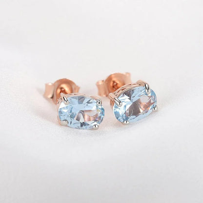 Geometrically simple sterling silver earrings in a rose gold finish, showcasing a minimalist and elegant design