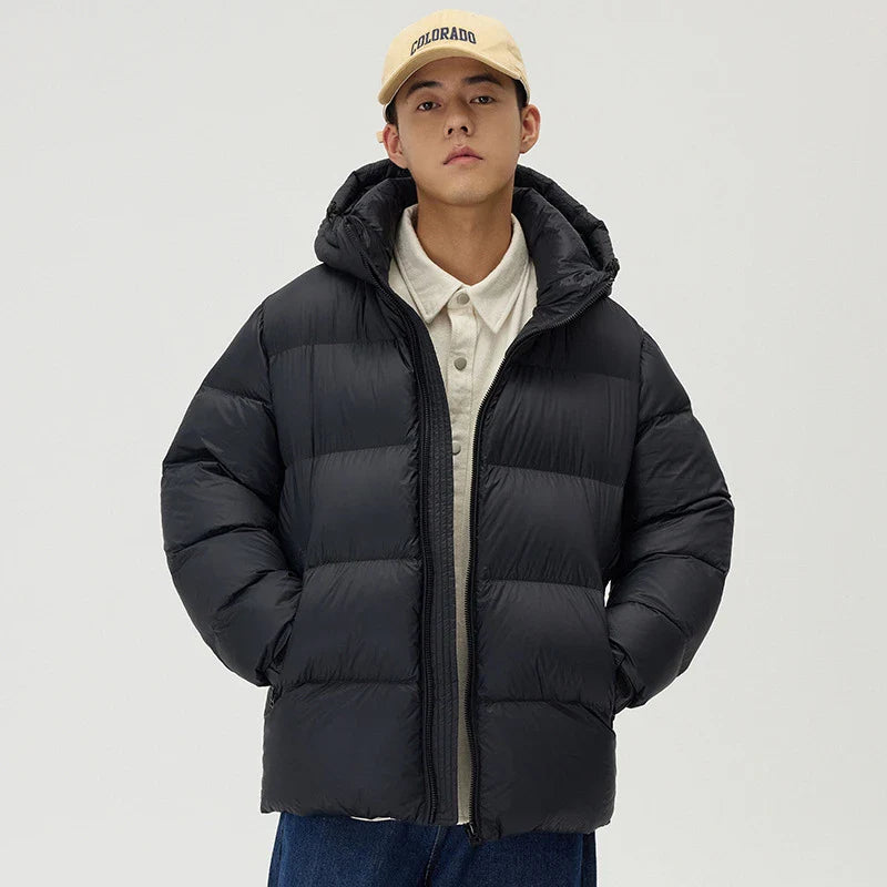 A stylish and warm down jacket with a hooded design, perfect for winter weather.