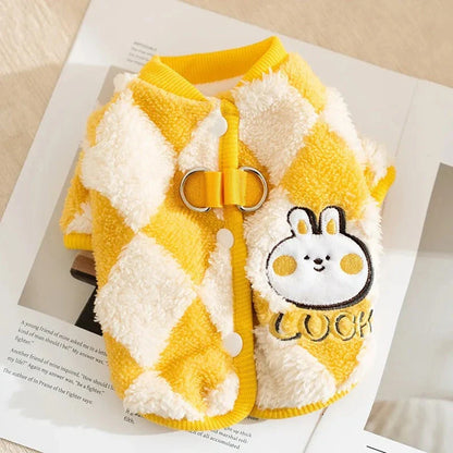 A stylish checkered fleece coat for small and medium-sized dogs, providing warmth and comfort during the chilly British autumn and winter seasons.