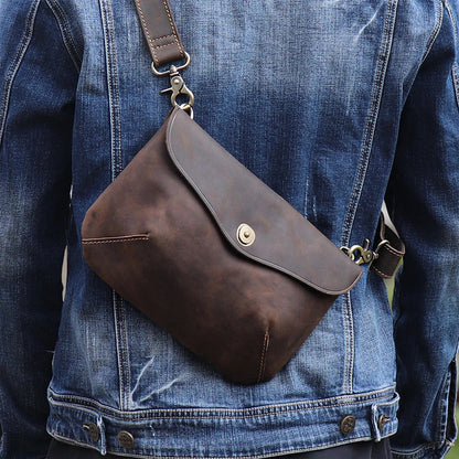 Premium handcrafted leather messenger bag in a classic British design, featuring a sturdy construction and spacious interior for the modern gentleman's everyday essentials.