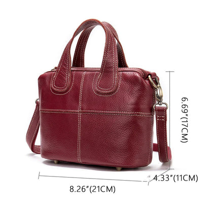 Premium leather shoulder bag for women in red, blue, and black colours with spacious interior and comfortable strap