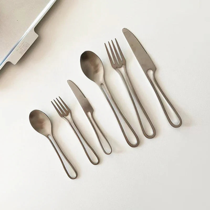Sophisticated 304 stainless steel cutlery set with sleek black finish for elegant dining in the UK