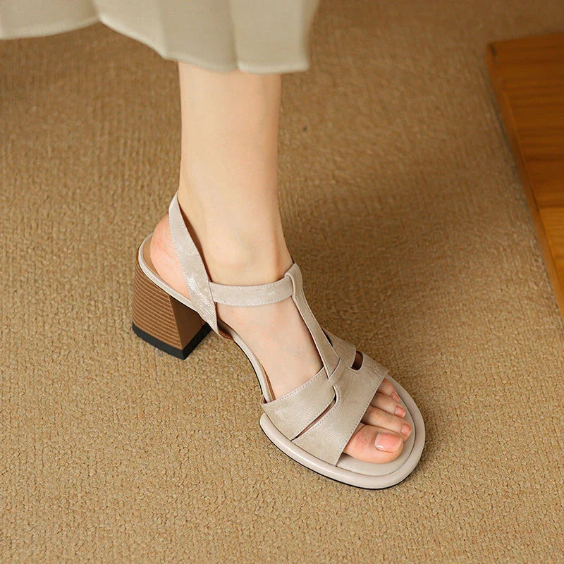 Genuine leather gladiator sandals with chunky heel, open-toe design, and secure buckle closure for summer style and comfort.