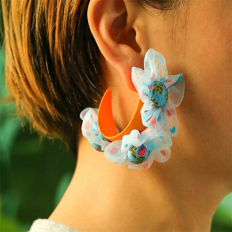 Exquisite handcrafted floral earrings with delicate fabric flowers and alloy accents, showcasing timeless British elegance