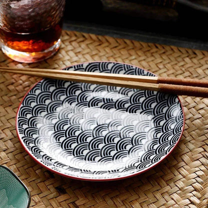 Elegant ceramic plates with vibrant, whimsical prints in a variety of enchanting designs
