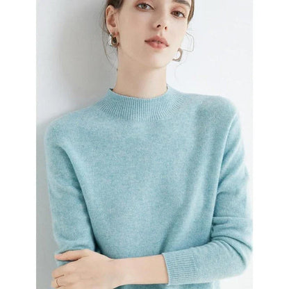 A woman wearing a luxurious Merino wool mock-neck jumper in a stylish autumnal outfit