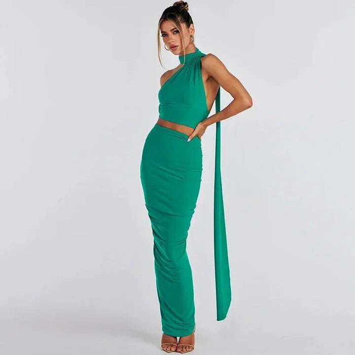 Glamorous backless cocktail dress set with halter-neck crop top and flowing maxi skirt in green colour
