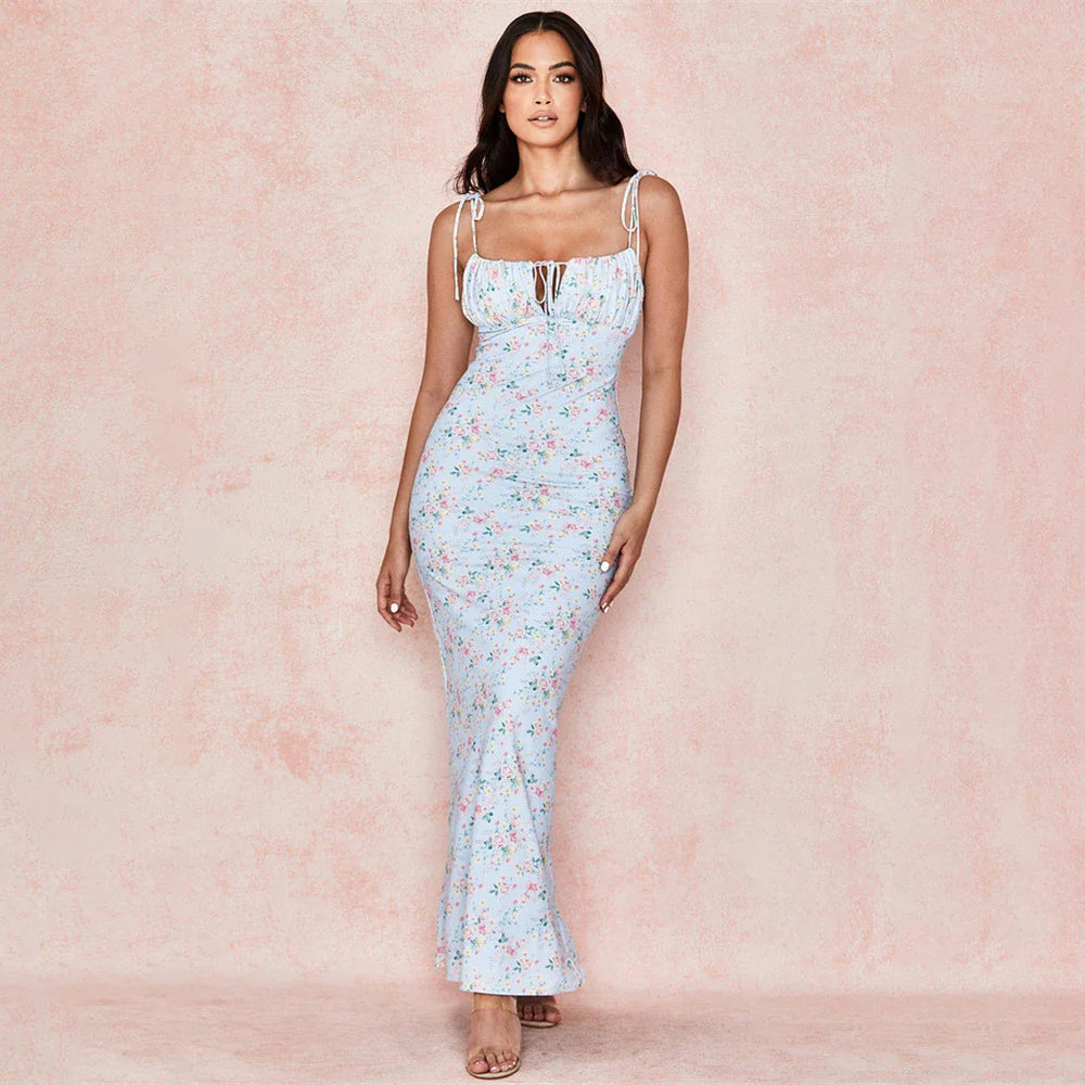 Elegant floral lace sling dress in blue, featuring a flattering high-waist silhouette and adjustable sling straps for a comfortable and stylish summer look.