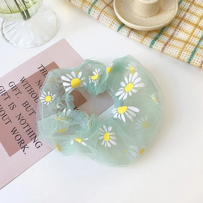 Handmade floral elastic hair bands with soft chiffon fabric and vibrant embroidered daisy patterns, perfect for enhancing everyday style in the UK.