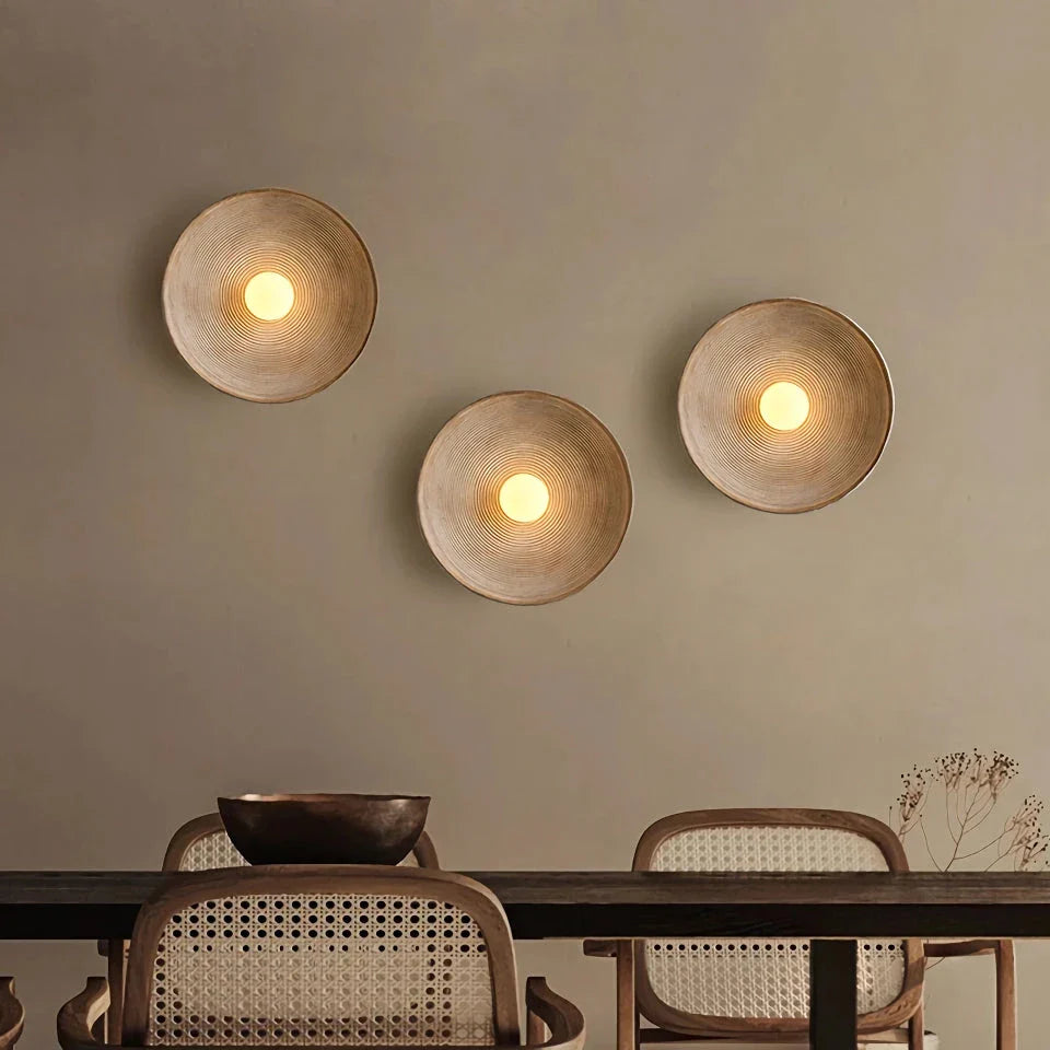 Elegant round wall light fixture with minimalist Wabi Sabi design, providing warm LED illumination for bedrooms and corridors