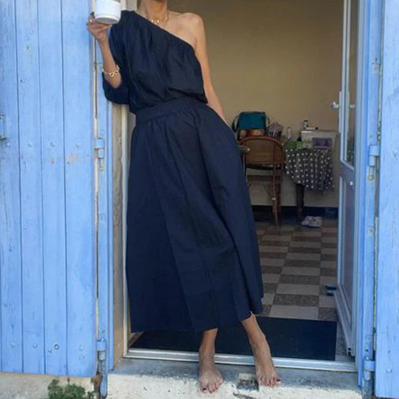 Elegant two-piece mid-length skirt suit with oblique shoulder design, made with premium polyester fabric and boutique four-sided elastic band