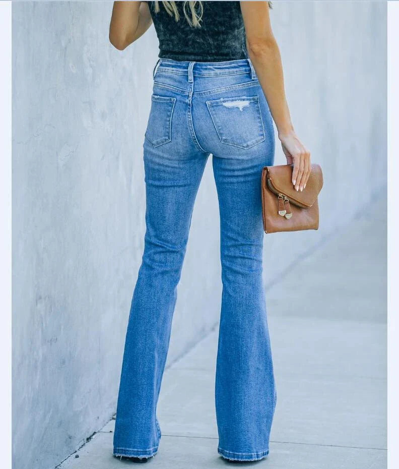 Premium distressed denim trousers for British women, featuring a high-waist silhouette and subtle ripped detailing