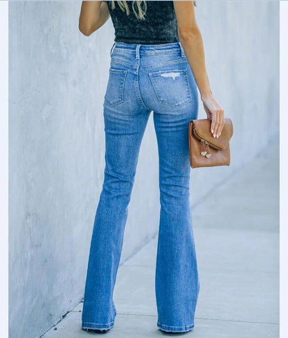Premium distressed denim trousers for British women, featuring a high-waist silhouette and subtle ripped detailing