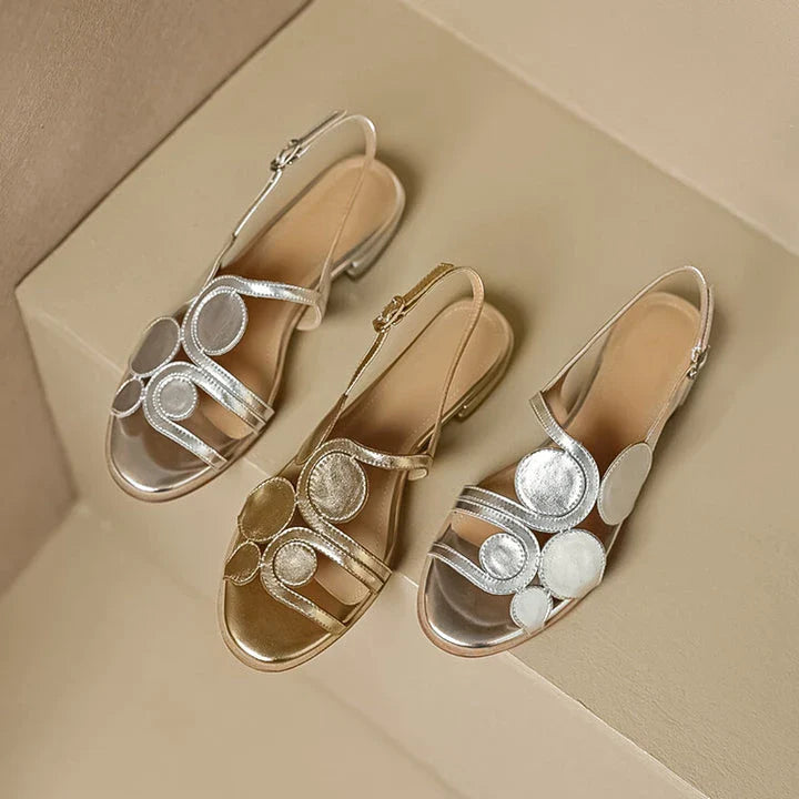 Chic sheepskin round toe sandals with a chunky heel and hollow out design, featuring a secure back strap and a modern, versatile style