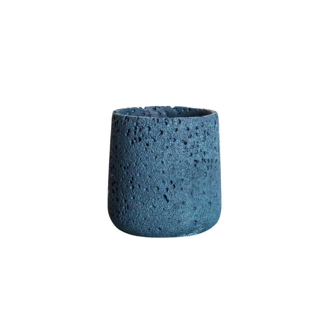 A modern, perforated cement bonsai planter in a Nordic-inspired design, available in various sizes and colours.
