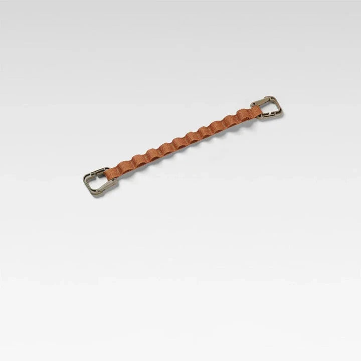Adjustable camping storage strap with multiple hanging rings for organising outdoor gear and supplies