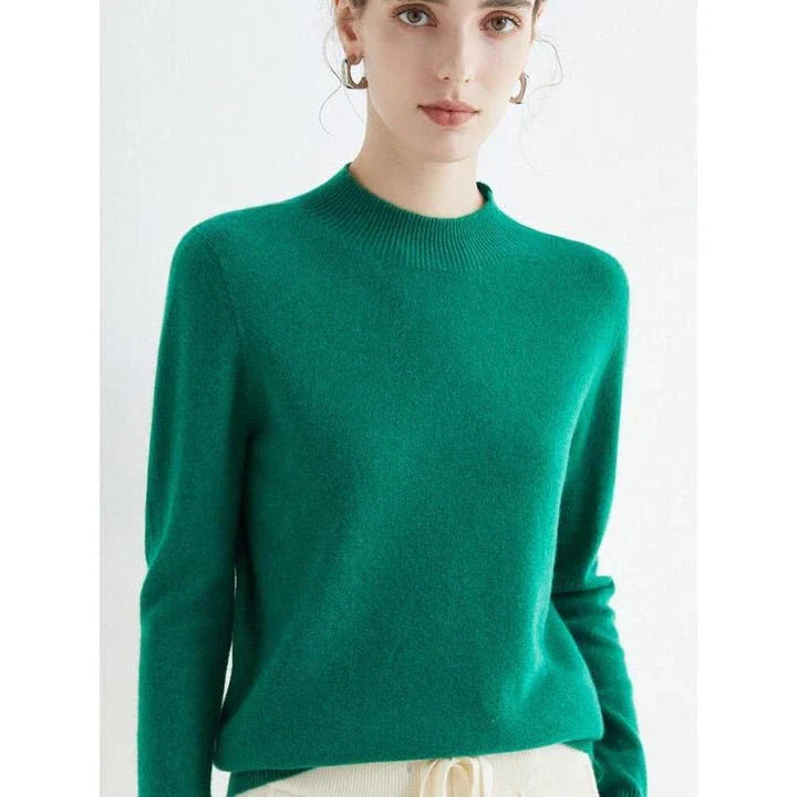 A woman wearing a luxurious Merino wool mock-neck jumper in a stylish autumnal outfit