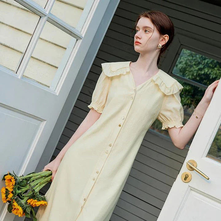 Elegant Navy Sailor Collar Dress with Signature Fungus-Edged Sleeves, a knee-length dress with a unique collar and delicate sleeve details