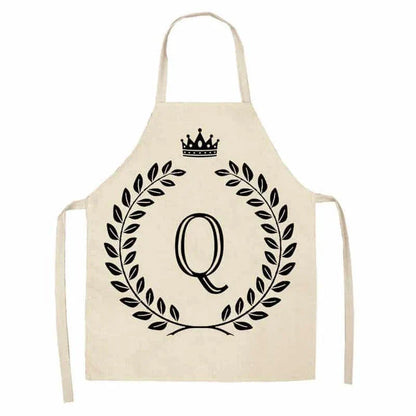 A high-quality kitchen apron featuring a charming crown and letter print design in a premium cotton and linen blend fabric.