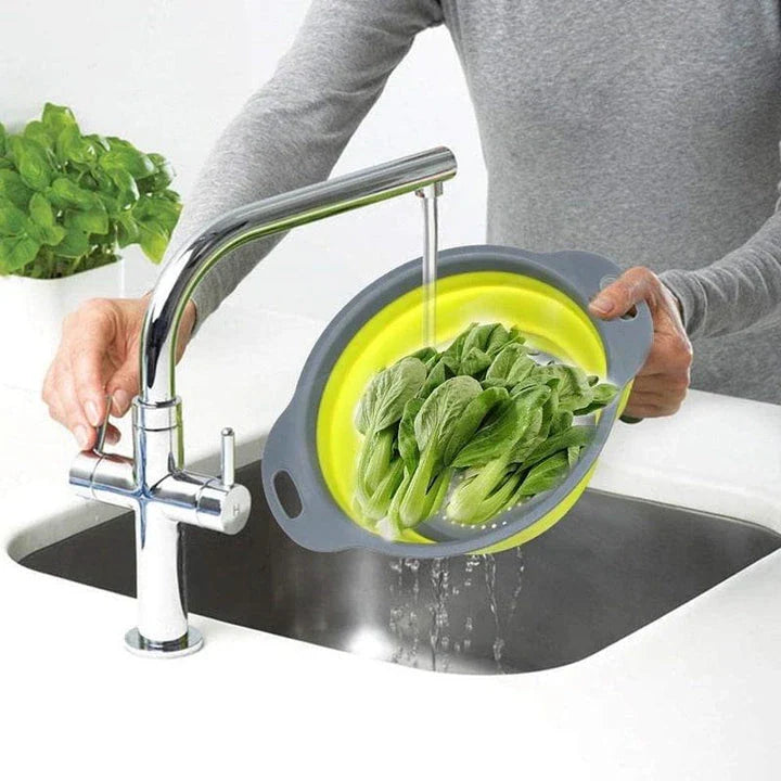 A vibrant, colourful folding colander made with durable food-grade materials for efficient straining and compact storage in the kitchen.