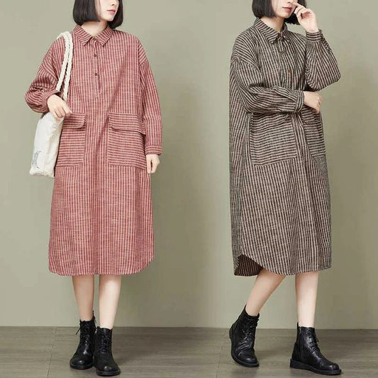 Plus-size women's dress with a striped pattern, asymmetric skirt, and long loose sleeves