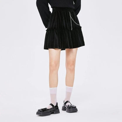 A stylish and playful above-knee mini skirt with intricate chain detailing, offering a versatile and fashionable addition to any wardrobe.