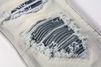 Stylish distressed denim jeans with a skinny, knee-exposed silhouette for a contemporary, high-street fashion look
