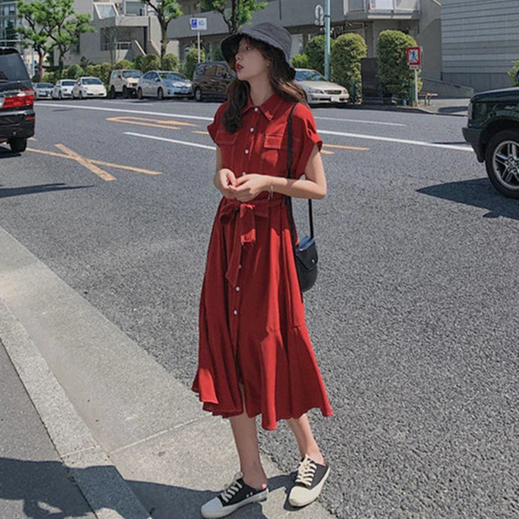 Elegant Hepburn-inspired fishtail shirt dress in blue, featuring a classic shirt design and flattering fishtail silhouette for a timeless British style.