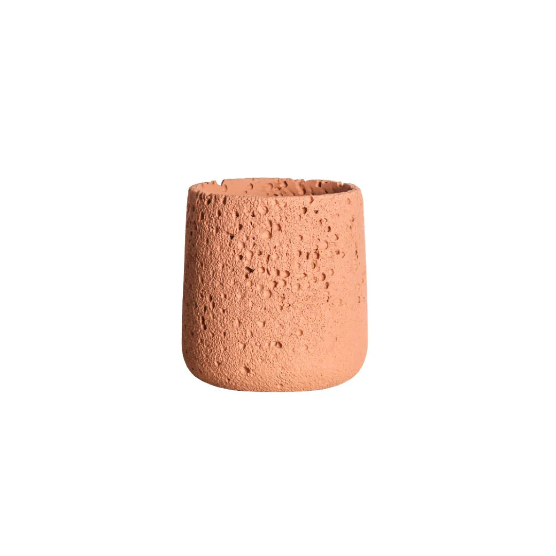 A modern, perforated cement bonsai planter in a Nordic-inspired design, available in various sizes and colours.