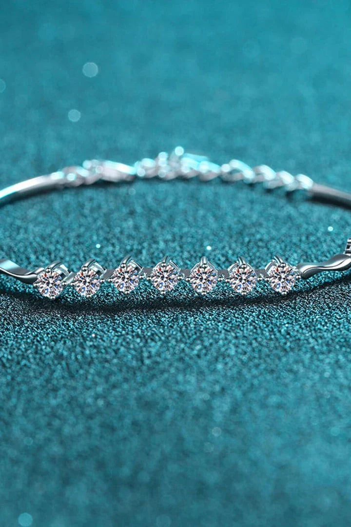 Elegant moissanite and sterling silver bracelet with a rhodium plated finish, designed for sophisticated style.