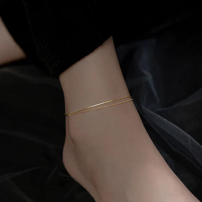 Elegant 14K gold-plated sterling silver anklet with intricate floral pattern and adjustable length