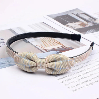 Charming bow headband for girls, a stylish hair accessory made from high-quality canvas and rubber for a comfortable, secure fit