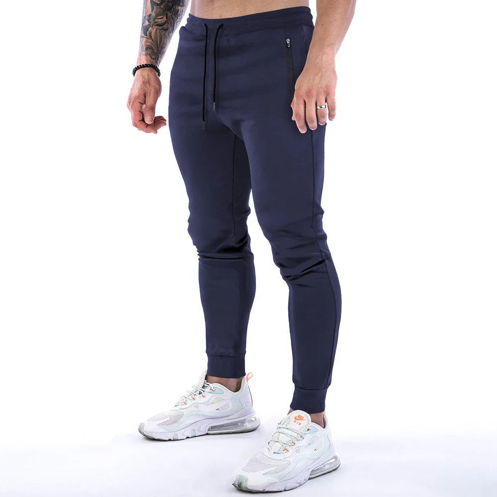 Premium athleisure trousers for stylish British men, featuring a refined sports-inspired design, breathable cotton construction, and a sleek, slim-fit silhouette.
