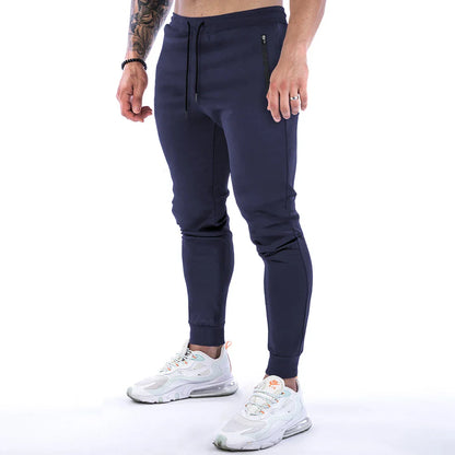 Premium athleisure trousers for stylish British men, featuring a refined sports-inspired design, breathable cotton construction, and a sleek, slim-fit silhouette.
